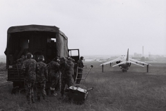 1973-74_jm_Ground Crew Shelter From the Ear Bashing and Jet Wash